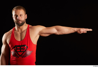 Dave  1 arm dressed flexing front view red tank…